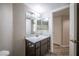 Updated bathroom featuring a large mirror, modern vanity, and stylish fixtures at 8455 W Sahara Ave # 154, Las Vegas, NV 89117