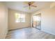 Bright bedroom with ceiling fan, and sliding glass door access to balcony at 8455 W Sahara Ave # 154, Las Vegas, NV 89117