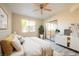 Sunlit bedroom with a sliding glass door and a neutral color scheme at 8455 W Sahara Ave # 154, Las Vegas, NV 89117