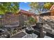 Relaxing patio with grill and a view of the community at 320 Brookside Ln # C, Las Vegas, NV 89107