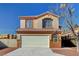 Charming two-story home with desert landscaping, tile roof, and a two-car garage at 3691 Springbud Dr, Las Vegas, NV 89147