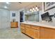 Bathroom features a large vanity, a walk-in shower and a TV at 9103 Alta Dr # 701, Las Vegas, NV 89145