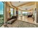 Spacious bedroom with hardwood floors, large windows and ornate bed at 9103 Alta Dr # 701, Las Vegas, NV 89145