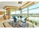 Elegant dining area with glass table, stunning views, and a chandelier at 9103 Alta Dr # 701, Las Vegas, NV 89145