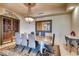 Formal dining room with granite table and chandelier at 9103 Alta Dr # 701, Las Vegas, NV 89145