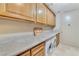 Bright laundry room with washer, dryer and ample cabinetry at 9103 Alta Dr # 701, Las Vegas, NV 89145