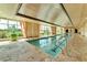 Indoor lap pool with large windows and elegant design at 9103 Alta Dr # 701, Las Vegas, NV 89145