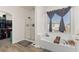 Bright bathroom featuring a soaking tub beneath a window and a glass walk-in shower at 9494 Alma Ridge Ave, Las Vegas, NV 89178