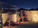 Landscaped backyard with gorgeous mountain views at night at 144 Juliette Pointe Ln, Henderson, NV 89011