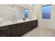 Modern bathroom with double vanity and large mirror at 144 Juliette Pointe Ln, Henderson, NV 89011