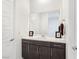 Clean and updated bathroom with dark cabinets and white countertop at 144 Juliette Pointe Ln, Henderson, NV 89011