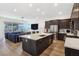 Modern kitchen with island, stainless steel appliances, and ample counter space at 144 Juliette Pointe Ln, Henderson, NV 89011