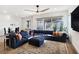 Relaxing living room with sectional sofa and large TV at 144 Juliette Pointe Ln, Henderson, NV 89011