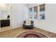 Cozy sitting area with comfortable chair and patterned rug at 144 Juliette Pointe Ln, Henderson, NV 89011