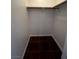 Large walk-in closet with dark brown tile flooring at 2120 Ramrod Ave # 415, Henderson, NV 89014