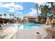 Inviting community pool with lounge chairs and umbrellas at 2120 Ramrod Ave # 415, Henderson, NV 89014