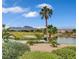 Scenic backyard view of lake, golf course, and mountains at 3020 Ripon Dr, Las Vegas, NV 89134