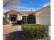 House exterior featuring a two-car garage and neatly landscaped front yard at 3020 Ripon Dr, Las Vegas, NV 89134