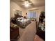 Spacious main bedroom with a comfortable bed, ample natural light, and sitting area at 3020 Ripon Dr, Las Vegas, NV 89134