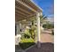 Covered patio with pergola, lush greenery, and mountain views at 3020 Ripon Dr, Las Vegas, NV 89134