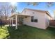 Covered patio with grassy area and mature trees at 5372 Polo Grounds St, Las Vegas, NV 89148