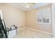 Bright bedroom featuring a ceiling fan and a large window with shutters at 5372 Polo Grounds St, Las Vegas, NV 89148