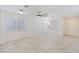 Bright and airy living room with tile flooring and plantation shutters at 5372 Polo Grounds St, Las Vegas, NV 89148