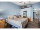 King-size bed in light blue primary bedroom with ensuite access at 5683 Whale Watch St, Las Vegas, NV 89113