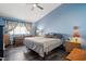 Spacious primary bedroom with a king-size bed and wood floors at 5683 Whale Watch St, Las Vegas, NV 89113