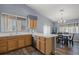 Kitchen with light wood cabinets, tile countertops, and stainless steel appliances at 5683 Whale Watch St, Las Vegas, NV 89113