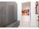 Contemporary entryway features modern art, a built-in bench, and sleek storage cabinets at 673 Falcon Cliff Ct, Henderson, NV 89012