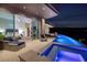 Home features a private infinity pool and integrated spa with breathtaking outdoor views and stylish furnishings at 673 Falcon Cliff Ct, Henderson, NV 89012