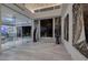 Modern foyer with glass doors, unique artwork, and a view into a bright office space at 673 Falcon Cliff Ct, Henderson, NV 89012