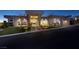 Contemporary home design featuring well-manicured landscaping and a striking entryway at 673 Falcon Cliff Ct, Henderson, NV 89012