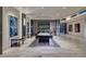 Bright and spacious game room with a pool table, large TV, and stylish design at 673 Falcon Cliff Ct, Henderson, NV 89012
