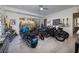 Spacious garage filled with motorcycles, guitars, and artwork, showcasing a stylish and functional space at 673 Falcon Cliff Ct, Henderson, NV 89012