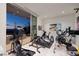 Well-equipped home gym with modern exercise equipment and access to outdoor terrace with great views at 673 Falcon Cliff Ct, Henderson, NV 89012