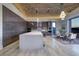 Stylish kitchen with a large island and modern appliances, plus dining area at 673 Falcon Cliff Ct, Henderson, NV 89012