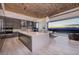 Well-appointed kitchen with stainless appliances, island, and indoor/outdoor dining at 673 Falcon Cliff Ct, Henderson, NV 89012