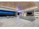 Expansive living room featuring a modern fireplace and city views at 673 Falcon Cliff Ct, Henderson, NV 89012