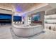 Bright living room with a sleek fireplace and access to a bar area at 673 Falcon Cliff Ct, Henderson, NV 89012