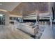 Spacious living room with a bar, opening to an outdoor area with views at 673 Falcon Cliff Ct, Henderson, NV 89012