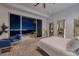 Stylish bedroom features a telescope, access to the outside, and comfortable seating at 673 Falcon Cliff Ct, Henderson, NV 89012