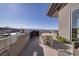 Outdoor kitchen and dining area overlooking city and mountain views at 673 Falcon Cliff Ct, Henderson, NV 89012
