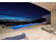 Nighttime poolside view of the city lights below at 673 Falcon Cliff Ct, Henderson, NV 89012