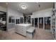 Expansive walk-in closet offers ample storage, custom shelving, and a center island with seating at 673 Falcon Cliff Ct, Henderson, NV 89012