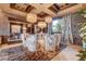 Elegant dining room with decorative lighting, a mirrored accent wall and sophisticated decor at 677 Boulder Summit Dr, Henderson, NV 89012