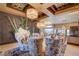 Stylish dining area with elegant furniture, contemporary lighting, and an open layout at 677 Boulder Summit Dr, Henderson, NV 89012