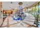 Foyer with stunning staircase, unique chandelier, and elegant tile flooring at 677 Boulder Summit Dr, Henderson, NV 89012