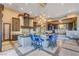 Spacious kitchen with large center island, pendant lighting, and modern blue bar stools at 677 Boulder Summit Dr, Henderson, NV 89012